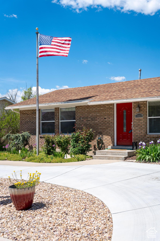 View of front facade featuring brick siding