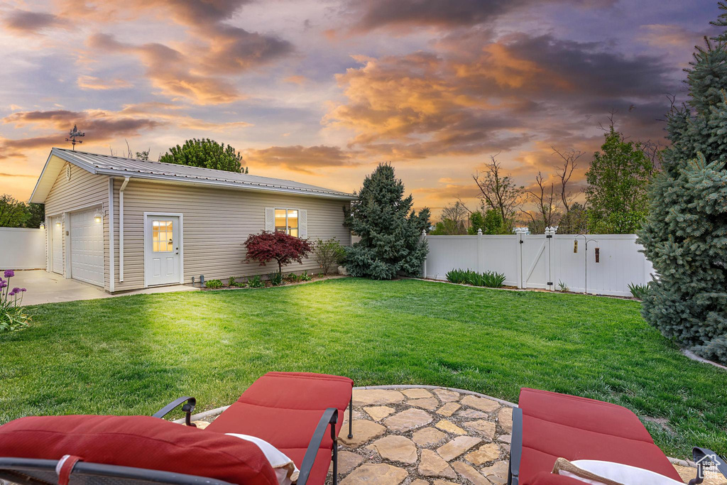 View of yard featuring a gate and a patio