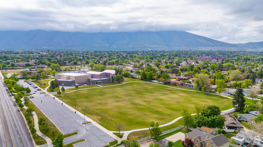 Aerial perspective of suburban area featuring a mountain backdrop