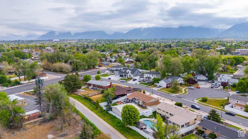 Aerial perspective of suburban area with a mountainous background