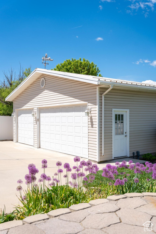 Garage with concrete driveway