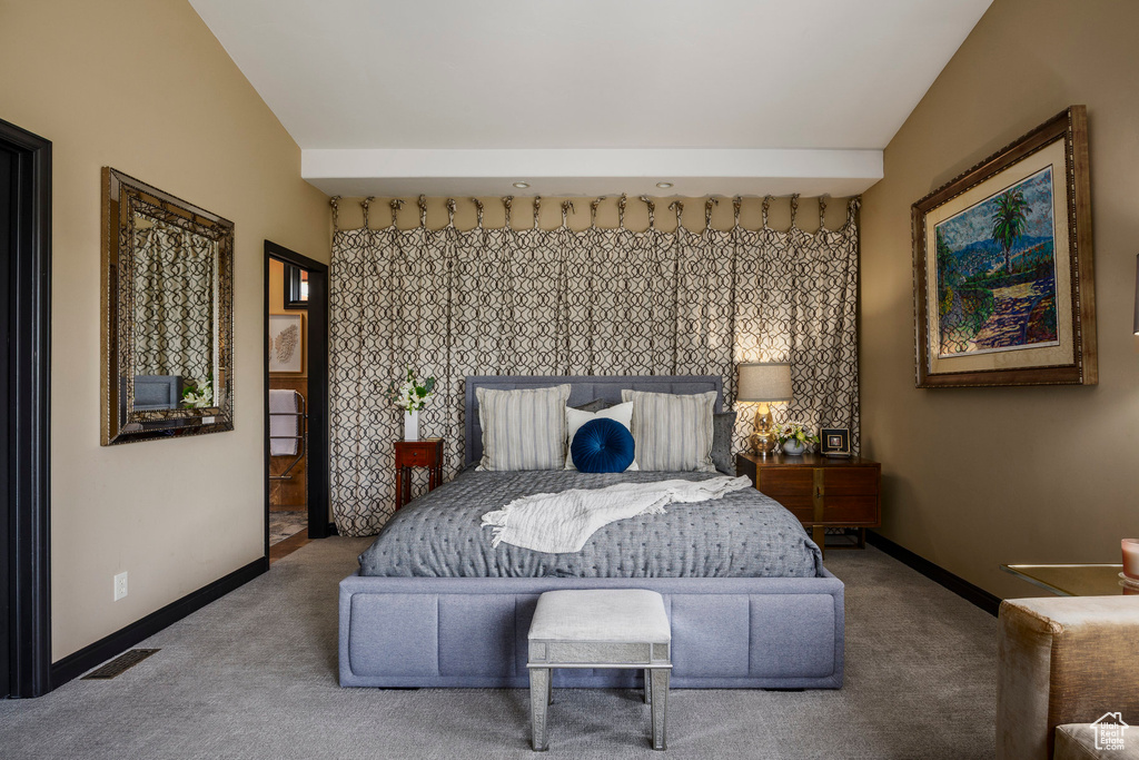 Carpeted bedroom featuring baseboards