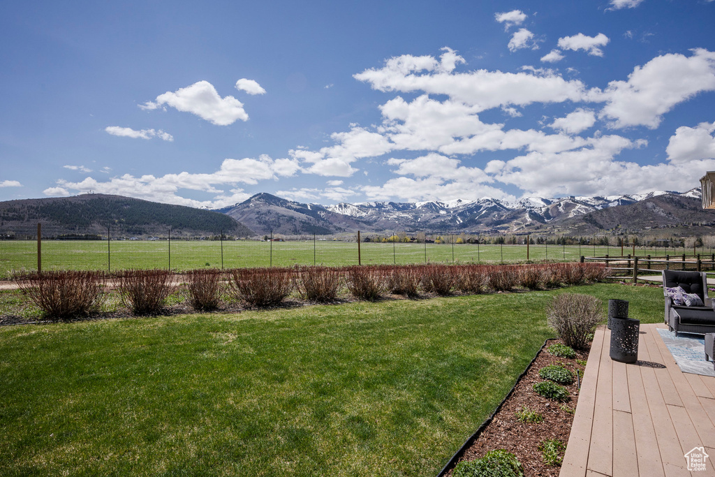 View of yard with a mountain view and a view of rural / pastoral area