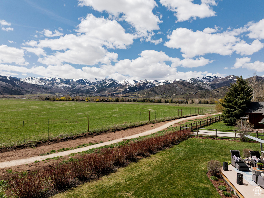 View of mountain backdrop featuring rural landscape and agricultural land