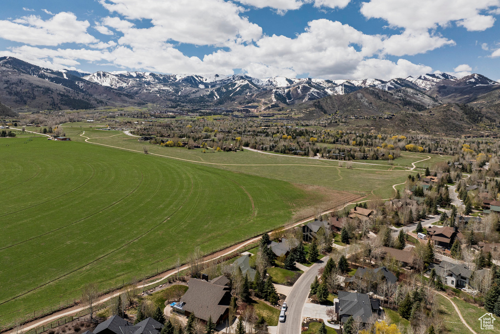 Aerial overview of property\'s location featuring a mountain backdrop