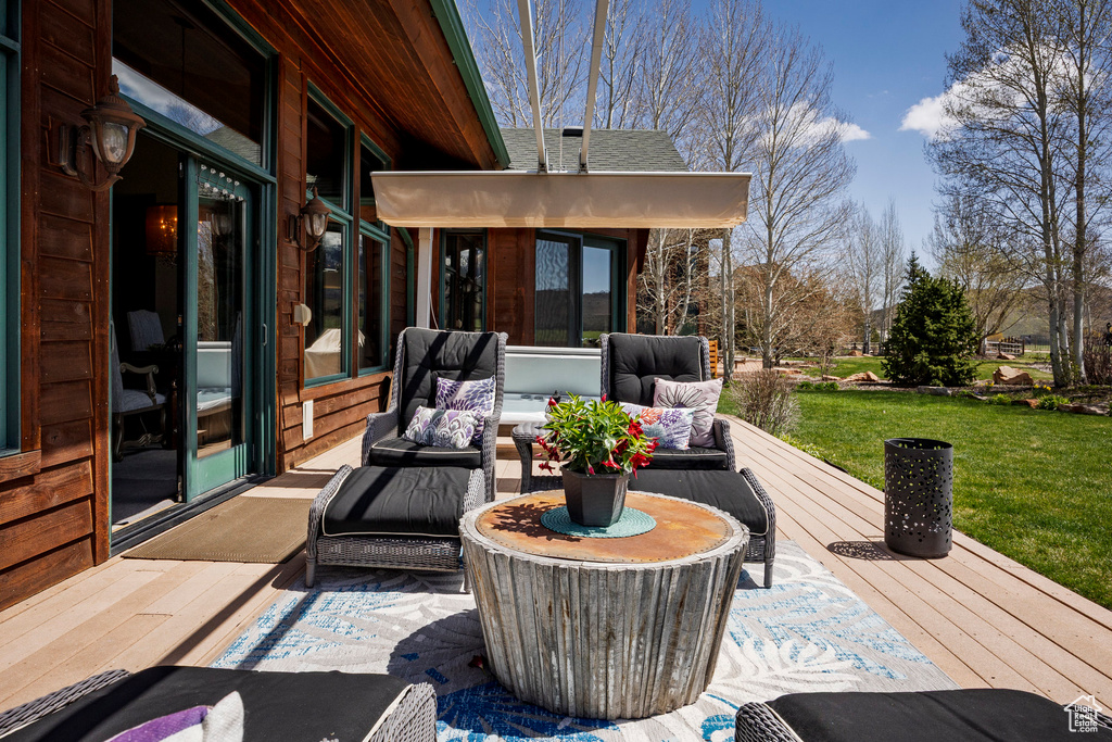 View of patio featuring a deck and an outdoor hangout area