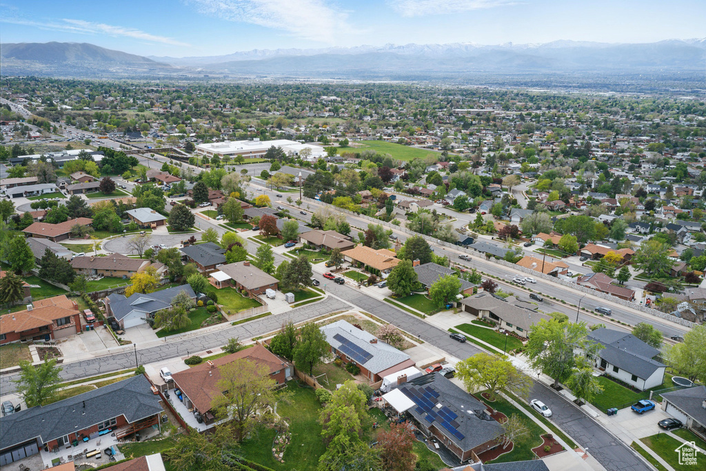 Aerial perspective of suburban area with a mountainous background