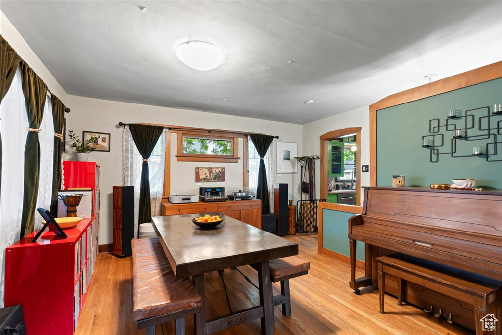 Dining area with light wood-type flooring