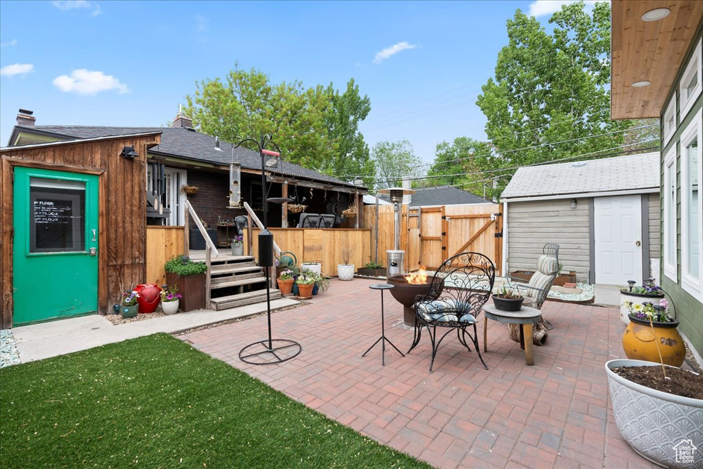 View of patio featuring a gate and fence
