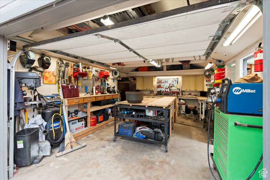 Garage featuring a workshop area