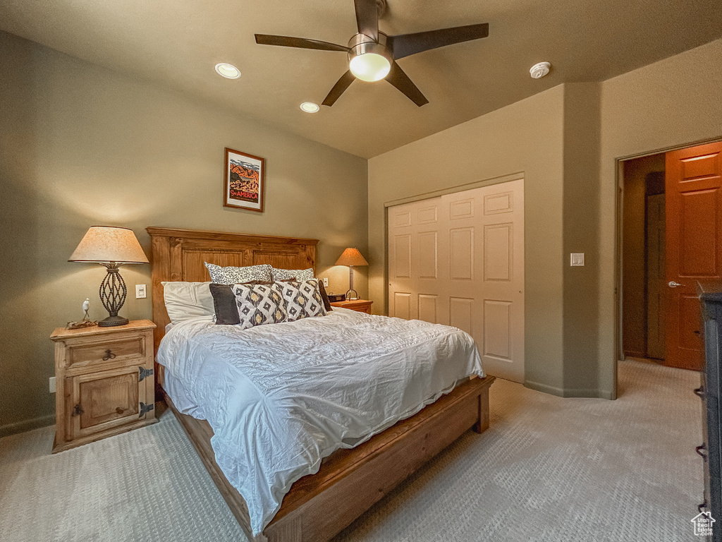 Bedroom featuring a closet, baseboards, ceiling fan, light carpet, and recessed lighting