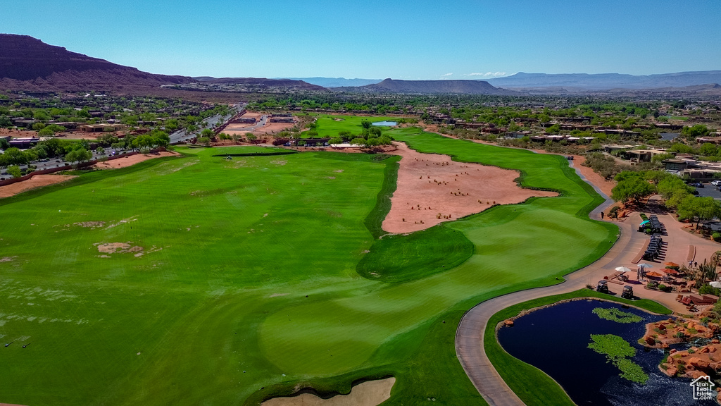 Aerial view of residential area with a golf course and a water and mountain view