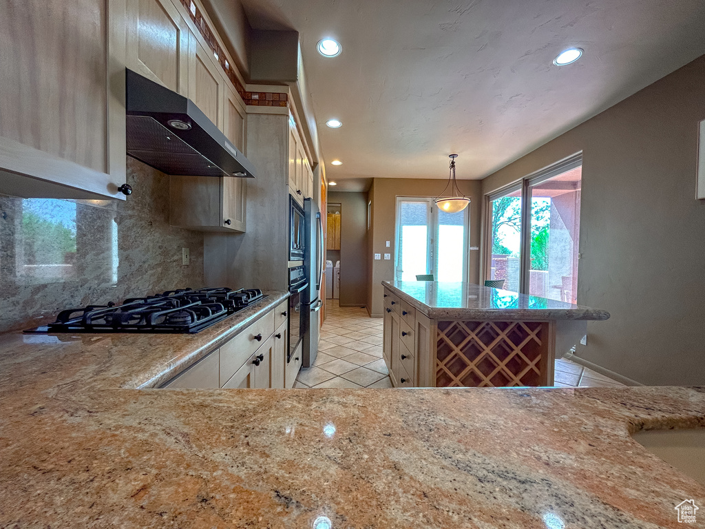 Kitchen featuring recessed lighting, light tile patterned floors, tasteful backsplash, and extractor fan
