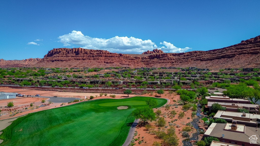 Birds eye view of property featuring golf course view, a residential view, and a mountain view