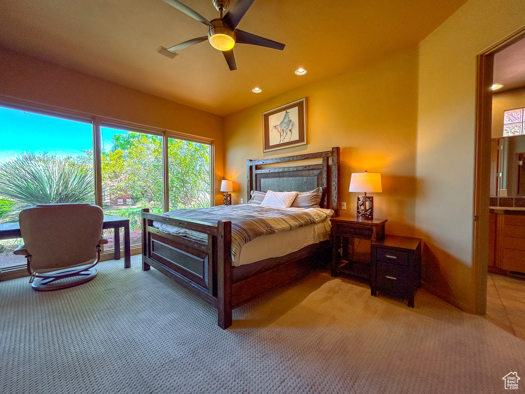Bedroom featuring light carpet, visible vents, ceiling fan, and recessed lighting