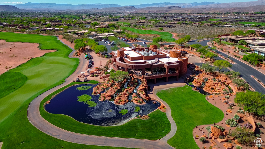 Drone / aerial view of a water and mountain view and a golf club