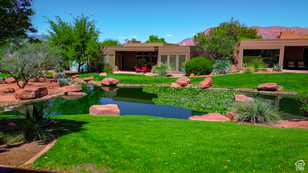 View of yard with a small pond