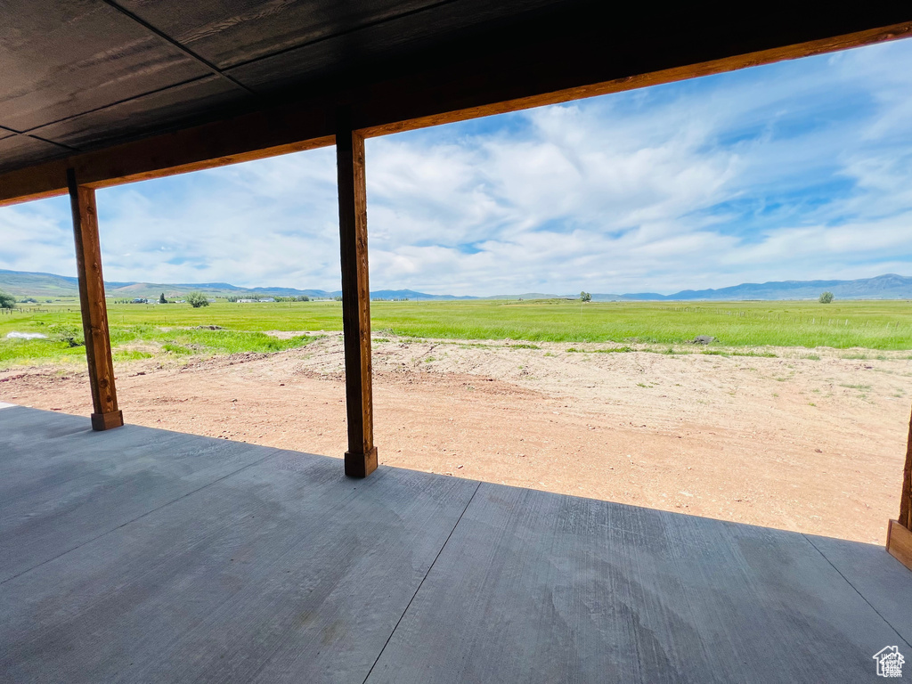 View of patio with a view of countryside and a mountain view