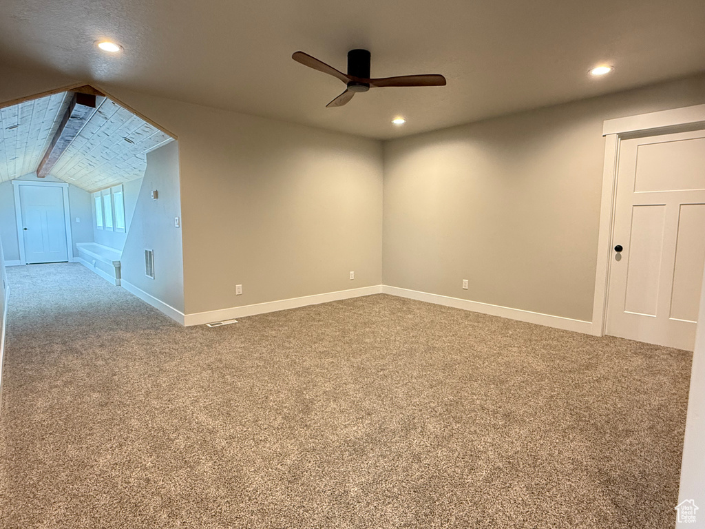 Spare room featuring a ceiling fan, carpet, recessed lighting, baseboards, and vaulted ceiling