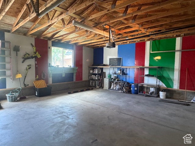 Garage featuring a garage door opener