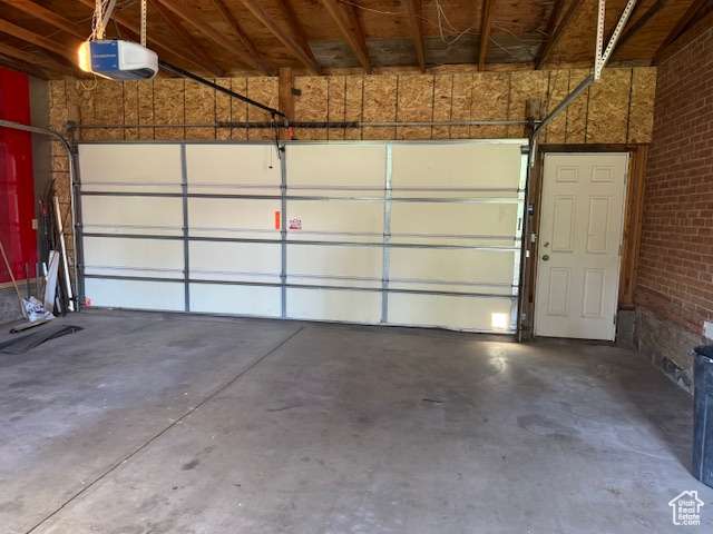 Garage featuring a garage door opener