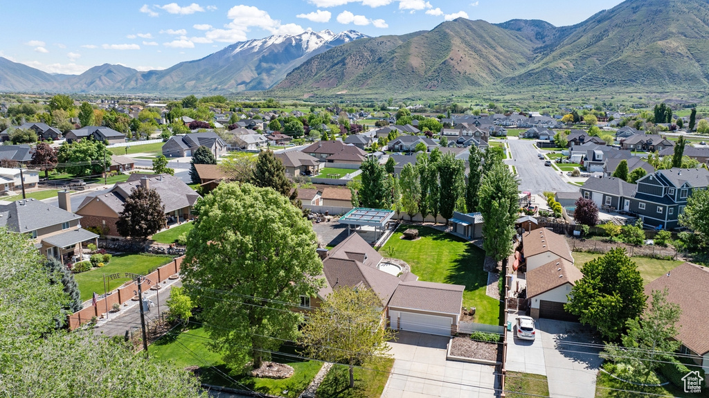 Aerial view of residential area featuring mountains