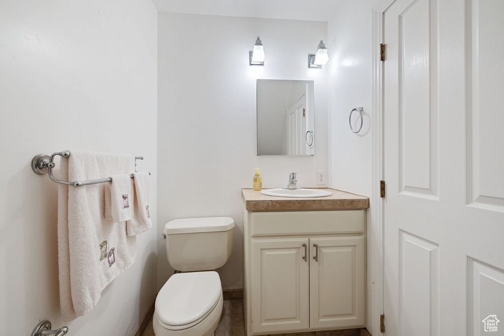 Bathroom with toilet and vanity