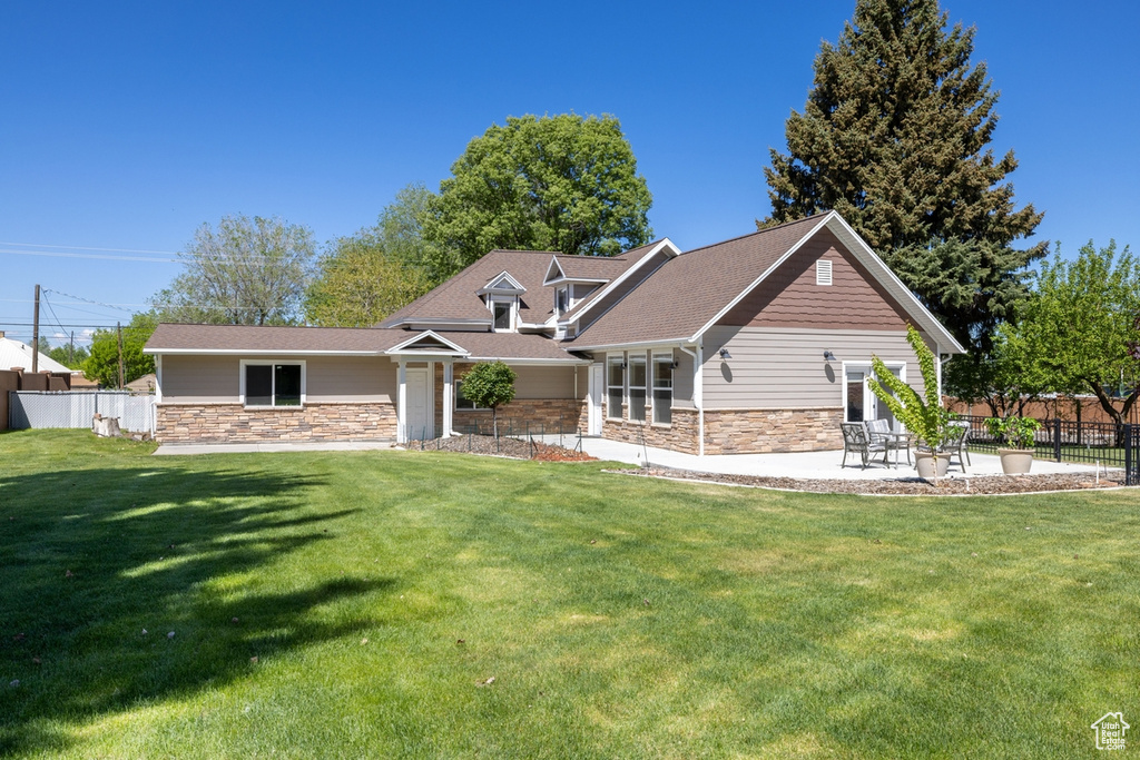 Craftsman inspired home with stone siding and roof with shingles