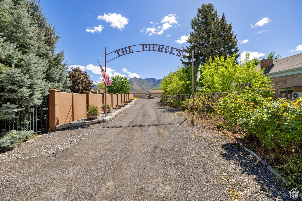 View of dirt / gravel road with a mountain view