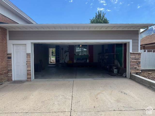 Garage with concrete driveway