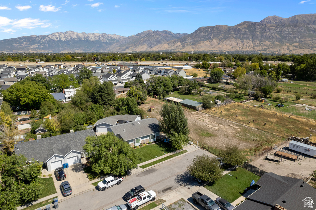 Aerial view of residential area featuring a mountainous background
