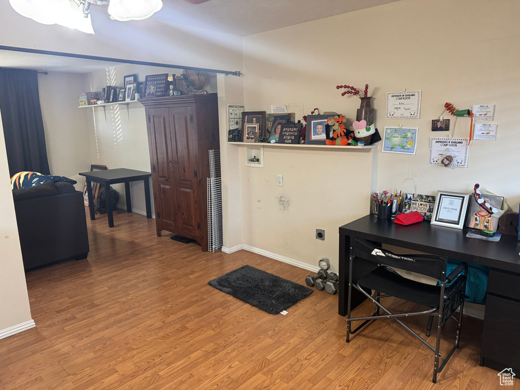 Office area featuring wood finished floors and baseboards