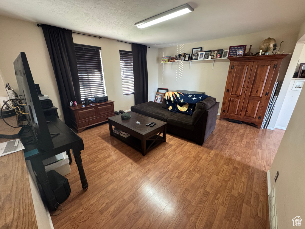 Living room with light wood-type flooring