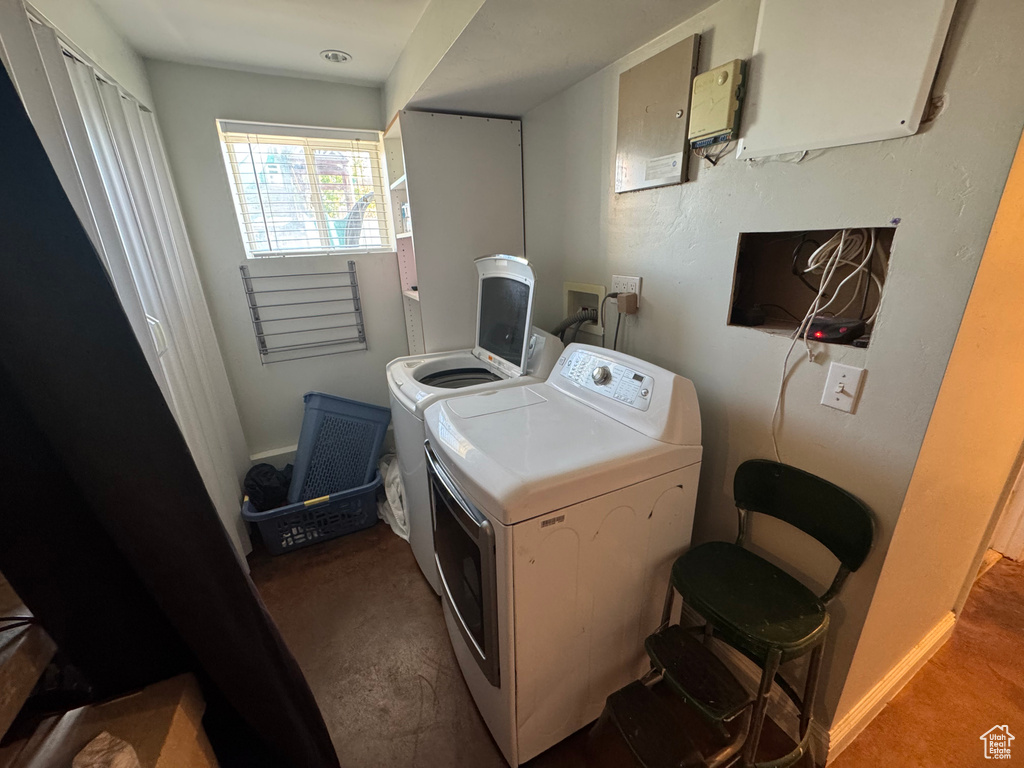 Laundry area featuring separate washer and dryer and carpet floors