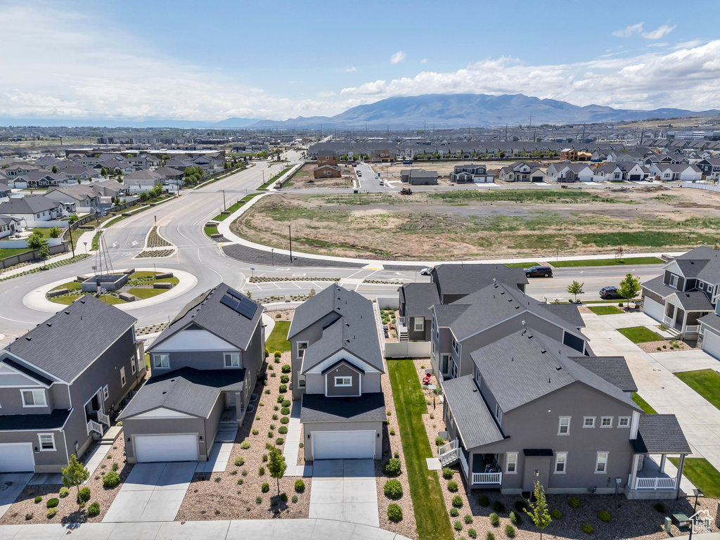 Aerial perspective of suburban area featuring a mountainous background
