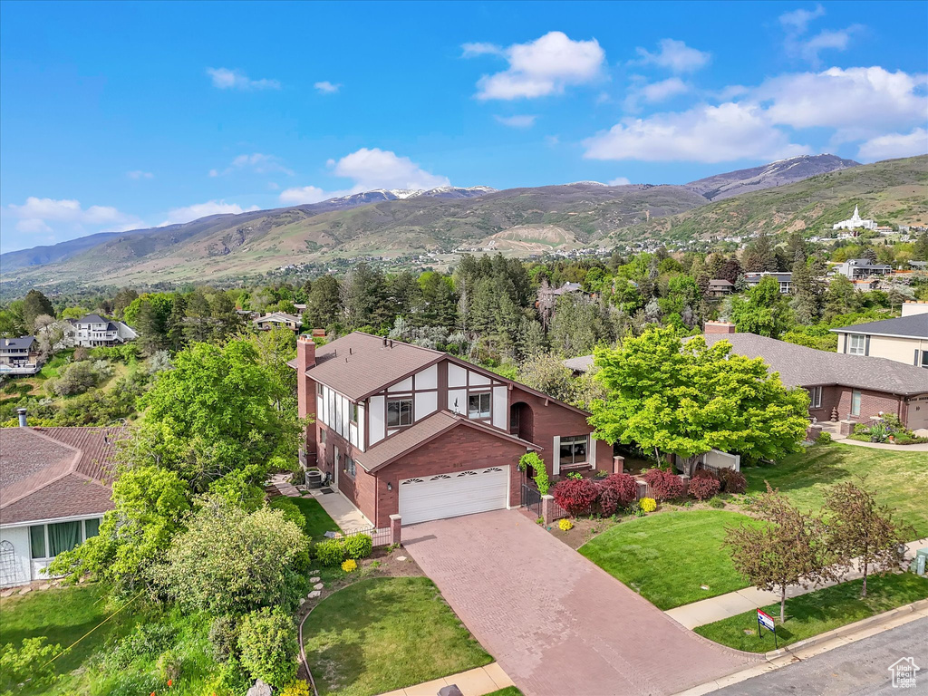 Aerial perspective of suburban area featuring a mountainous background
