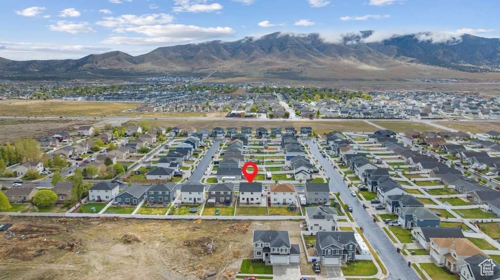 Aerial view of property\\\'s location featuring a mountain backdrop and nearby suburban area