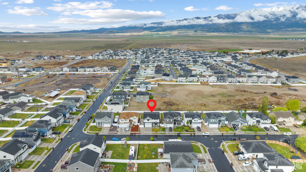 View of property location featuring a mountain backdrop and nearby suburban area