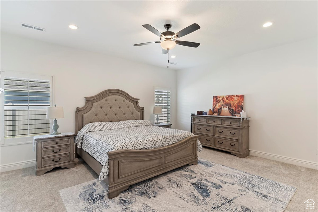 Bedroom featuring light carpet, recessed lighting, baseboards, and ceiling fan