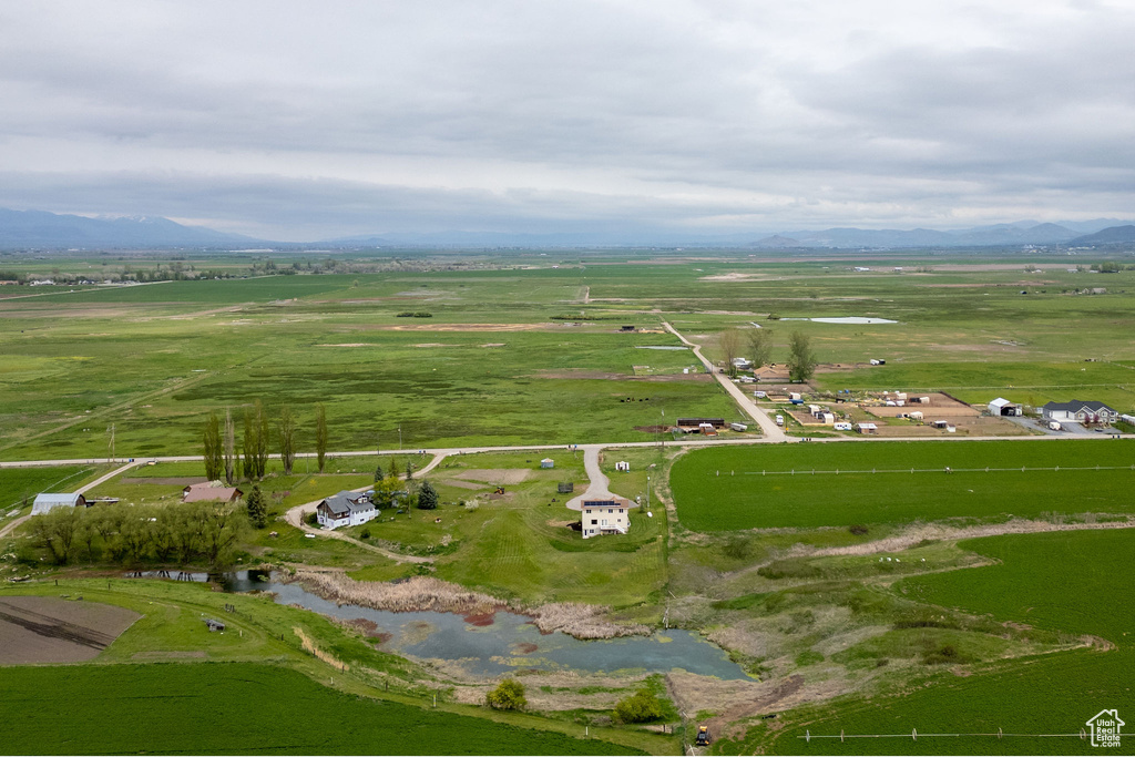 Aerial overview of property's location with rural landscape and a mountain backdrop