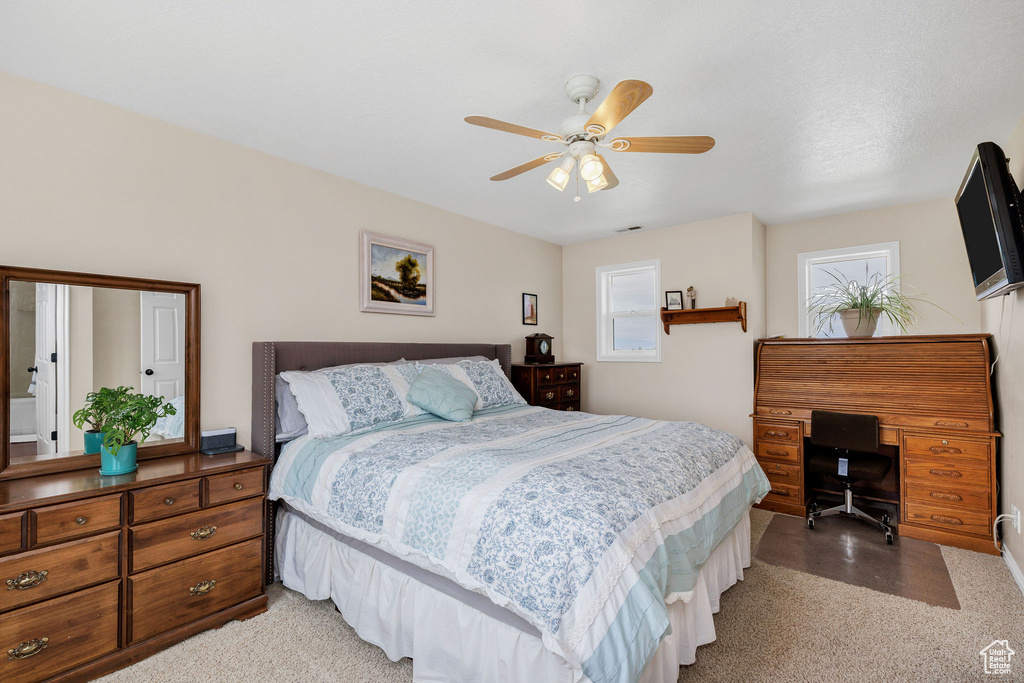 Bedroom with a desk and a ceiling fan