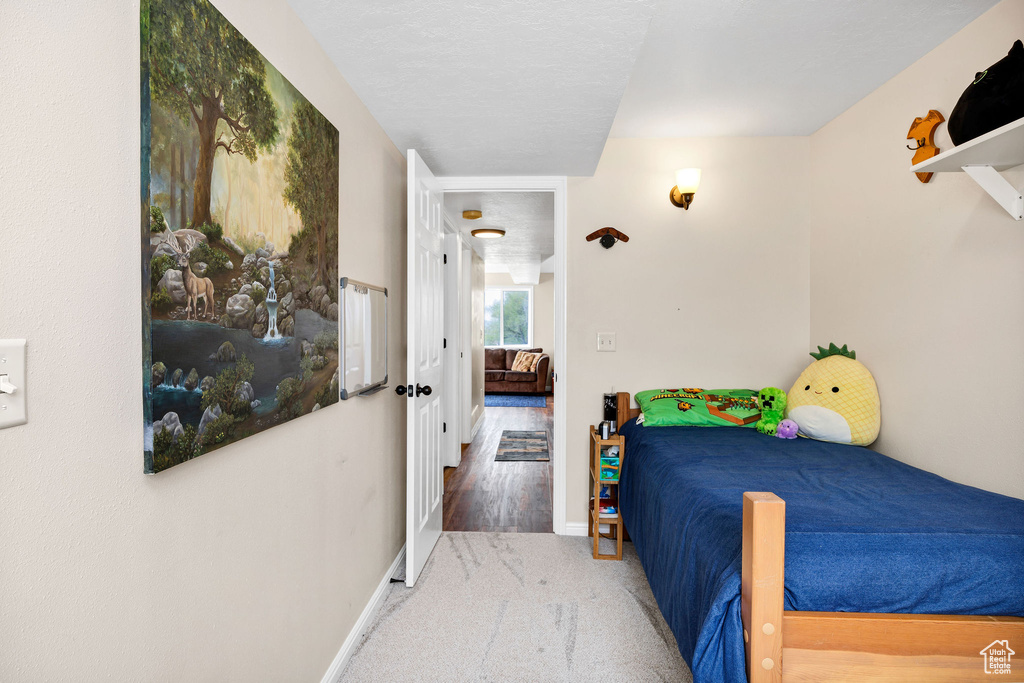 Bedroom with carpet flooring and baseboards
