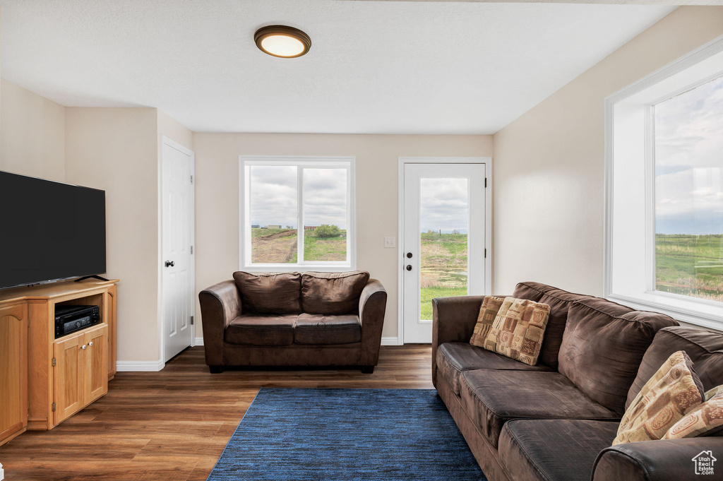 Living area featuring wood finished floors and baseboards