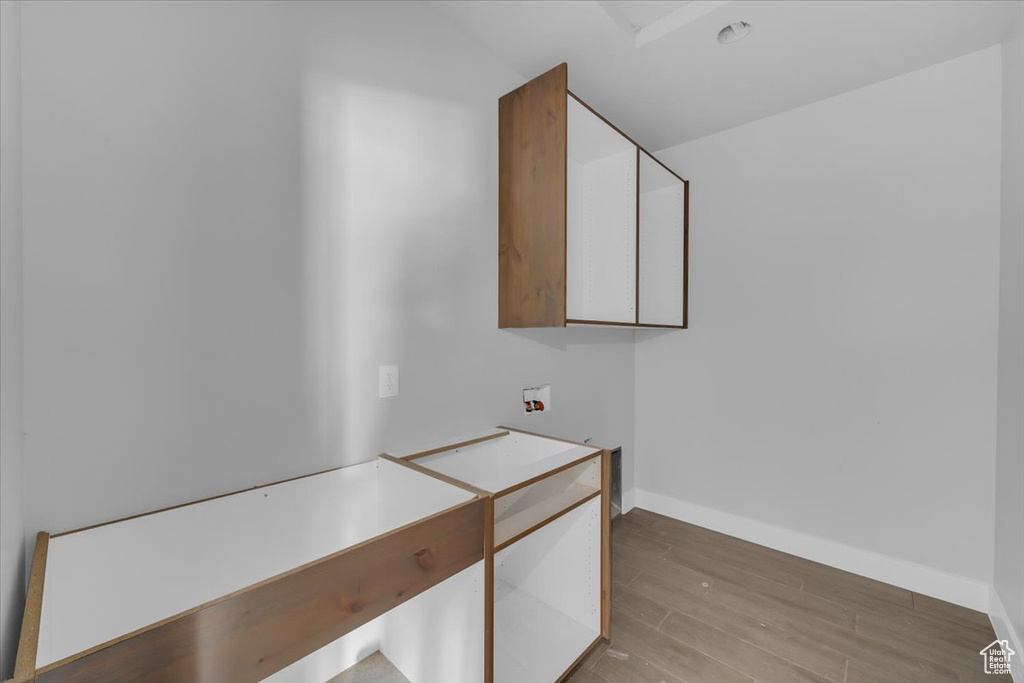 Interior space with light wood-type flooring and baseboards