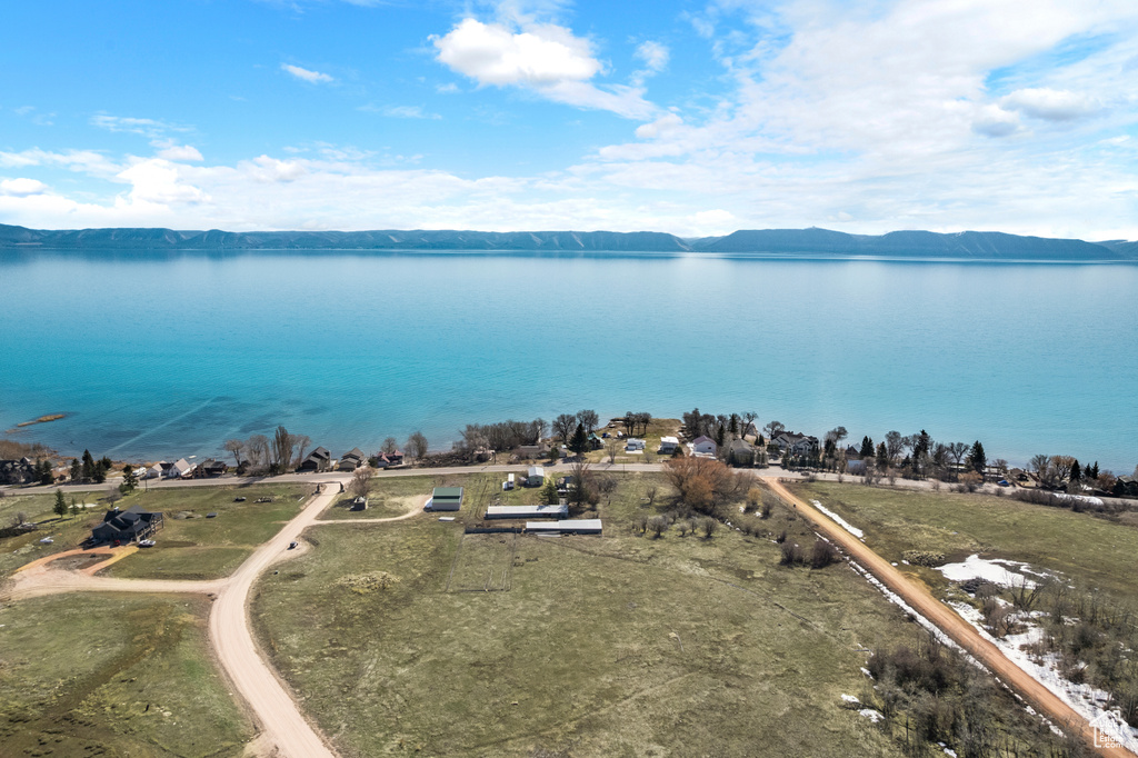 Aerial view featuring a water and mountain view