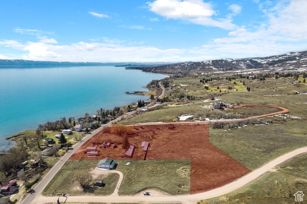 Aerial view featuring a water and mountain view
