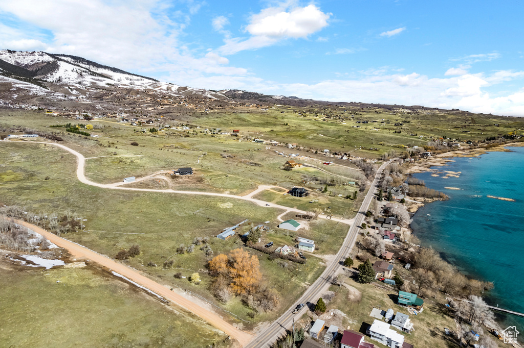 Aerial view featuring a water and mountain view