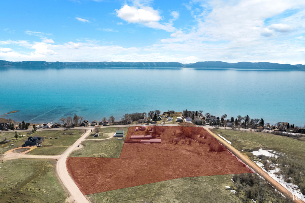 Drone / aerial view with a water and mountain view
