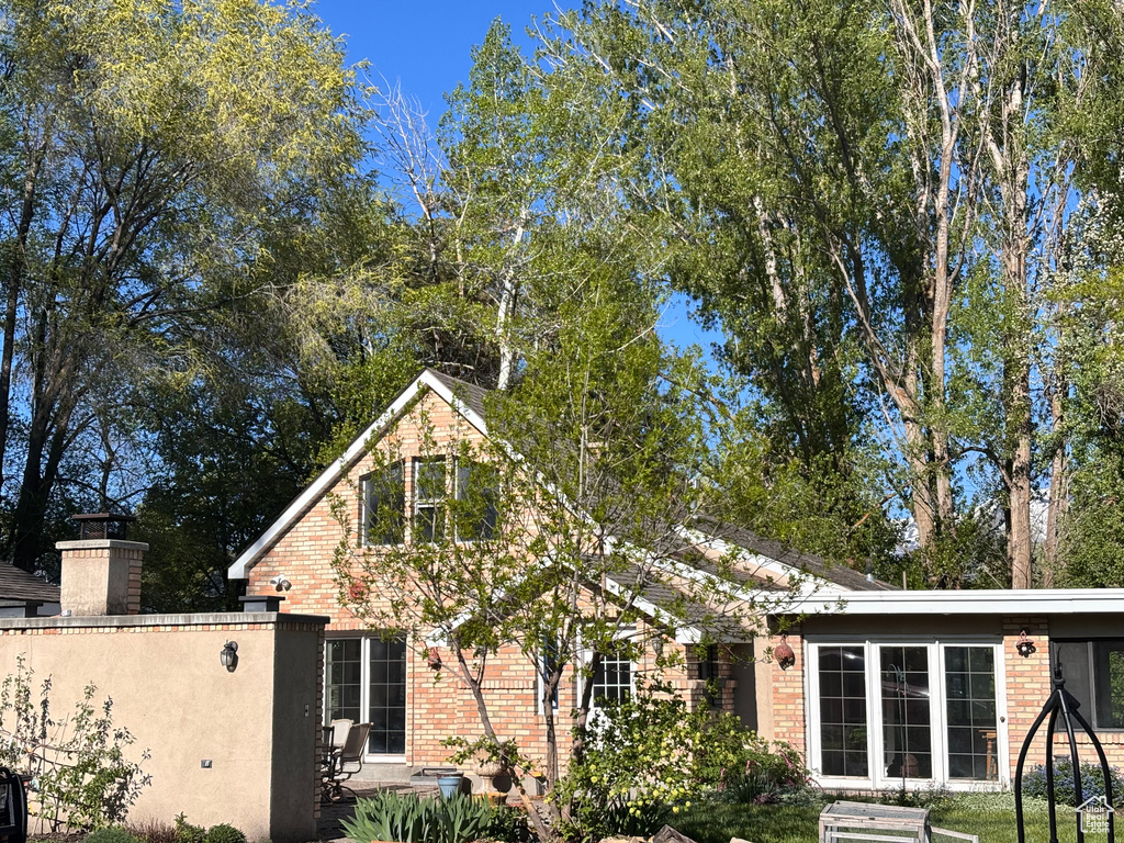 View of front of house featuring brick siding