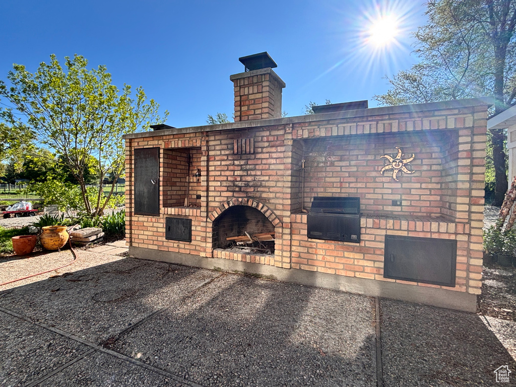 View of patio / terrace featuring a fireplace